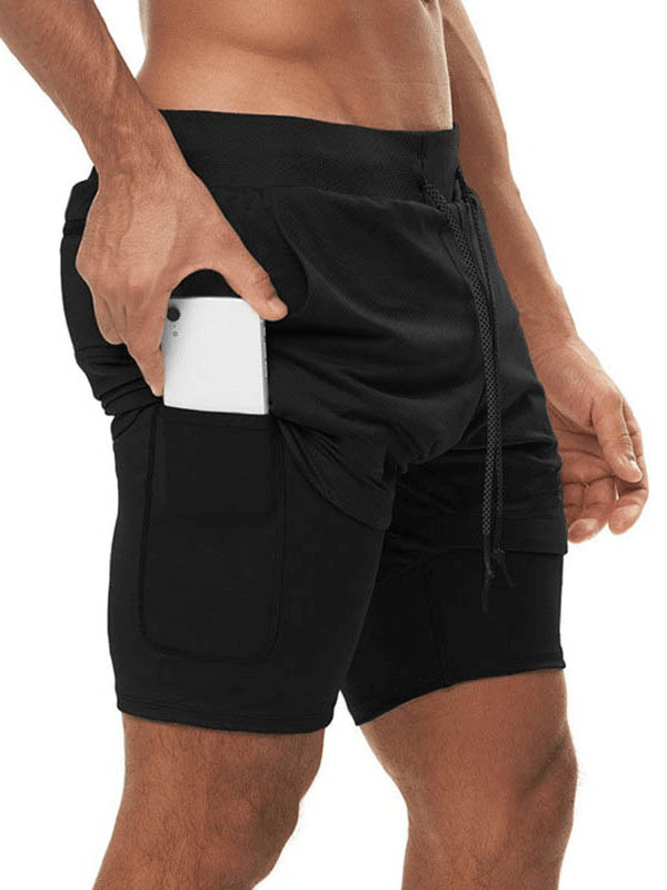 Man wearing black elastic fitness running double shorts with phone pocket, designed for intense workouts and comfort.