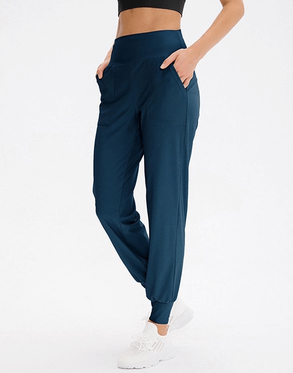 Elastic lightweight women's sweatpants with pockets for yoga and outdoor activities, featuring adjustable fit and comfort.