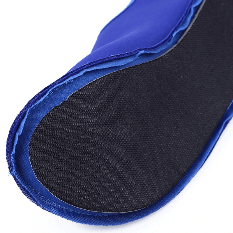 Close-up of blue elastic beach shoe with black rubber sole, showcasing quick-drying features for superior grip and comfort.