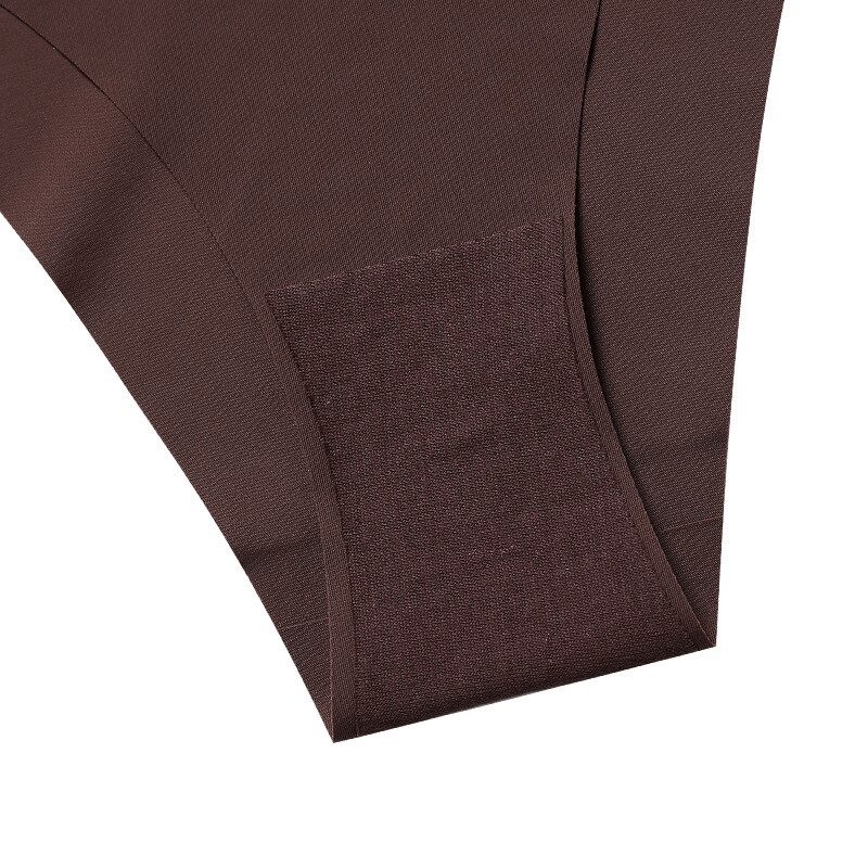 Close-up view of elastic seamless breathable women's sports brief in dark brown, highlighting comfortable and breathable fabric.