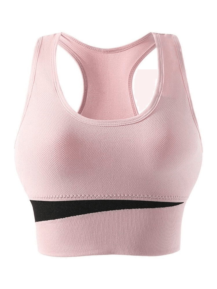 Sleek blush pink wireless women's sports bra, ideal for yoga and running, made from breathable nylon for comfort and support.