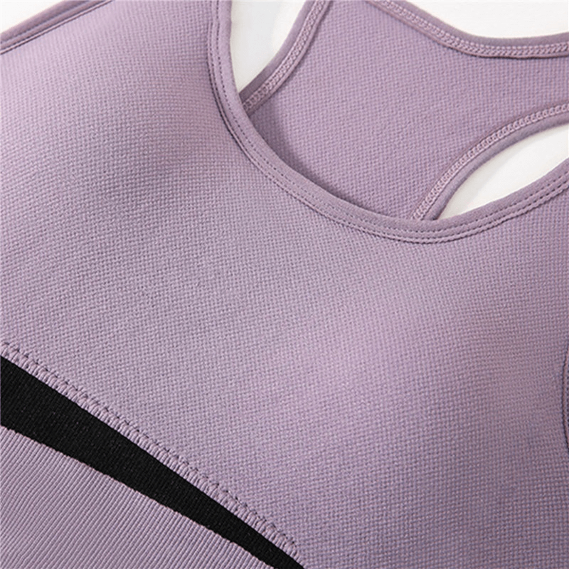 Sleek purple wireless sports bra for women, designed for yoga, running; breathable nylon fabric for comfort and freedom of movement.
