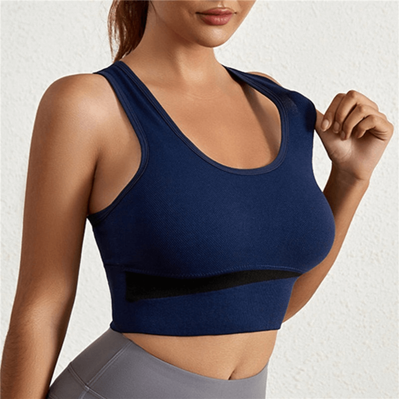 Elastic wireless bra sports top in blue, perfect for yoga or running. Nylon fabric ensures comfort and freedom of movement for women.