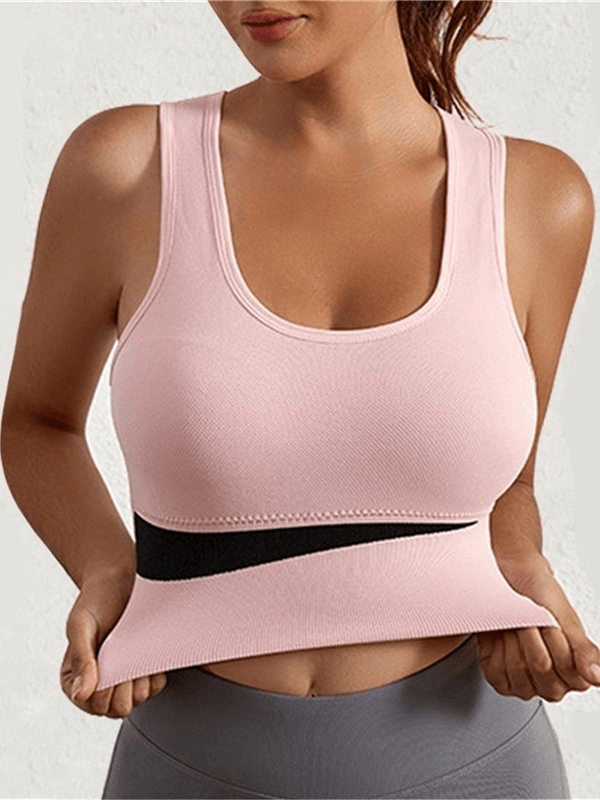 Women in pink sports top showcasing the Elastic Sexy Wireless Bra, perfect for yoga and active lifestyle. SF0473, nylon material.