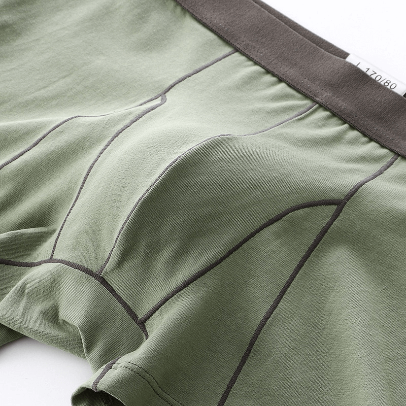 Elastic Soft Boxer Briefs in green with black stitching, showcasing premium cotton and durable design for men's comfort and breathability.