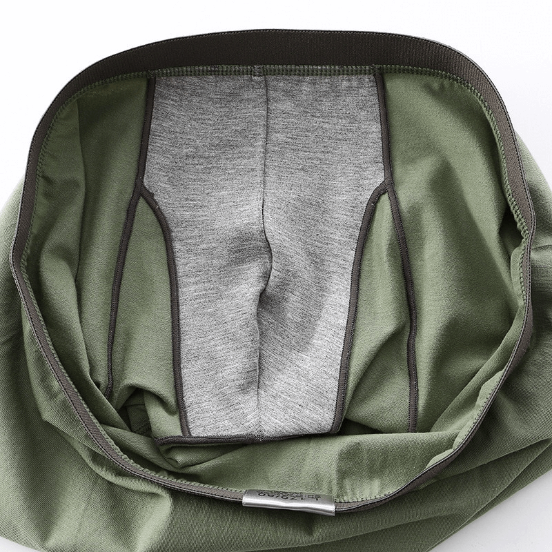 Elastic soft men’s boxer briefs with solid pattern and green color featuring a premium cotton waistband for comfort and durability.