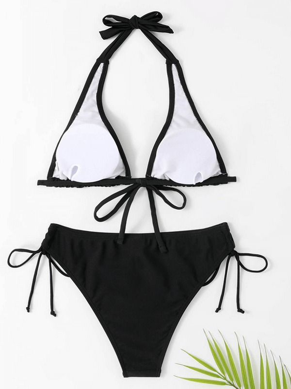 Elastic split solid color women's bikini in black, perfect for beachwear and sunbathing, made of comfortable polyester blend.