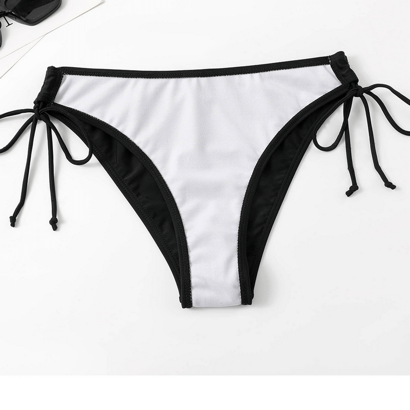 White and black split-style women's bikini bottom with side ties, ideal for beachwear. Made of elastic Polyester and Spandex blend.