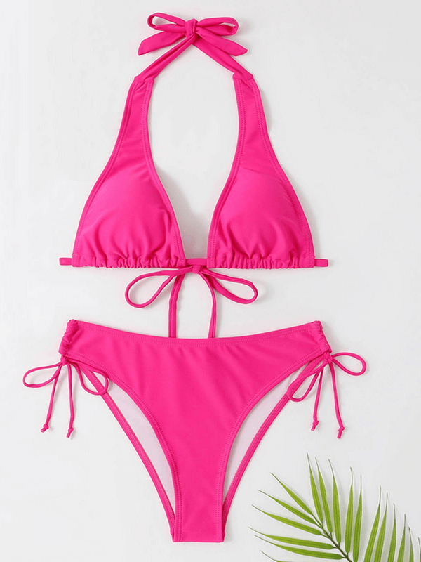 Bright pink split bikini set with bow tie straps, ideal beachwear for women, featuring a halter neckline and mid-waist bottoms.