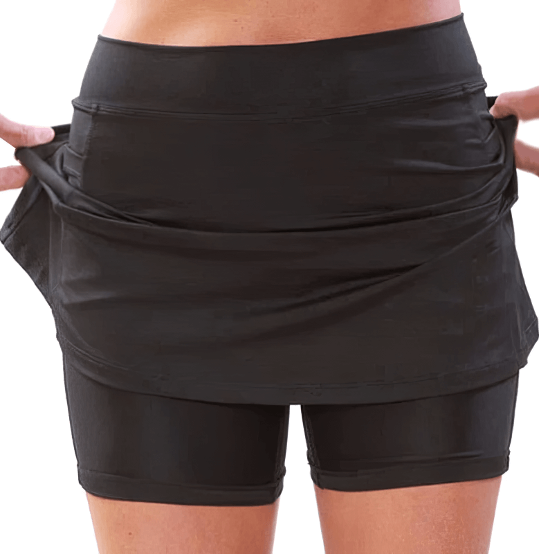Elastic sport women's skirt-shorts with side pocket, featuring a pleated silhouette and natural waistline. Ideal for active women.