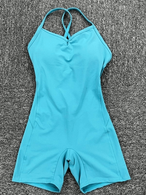 Elastic sports short women's open-back jumpsuit in blue, made of breathable nylon with high elasticity for a flexible workout.