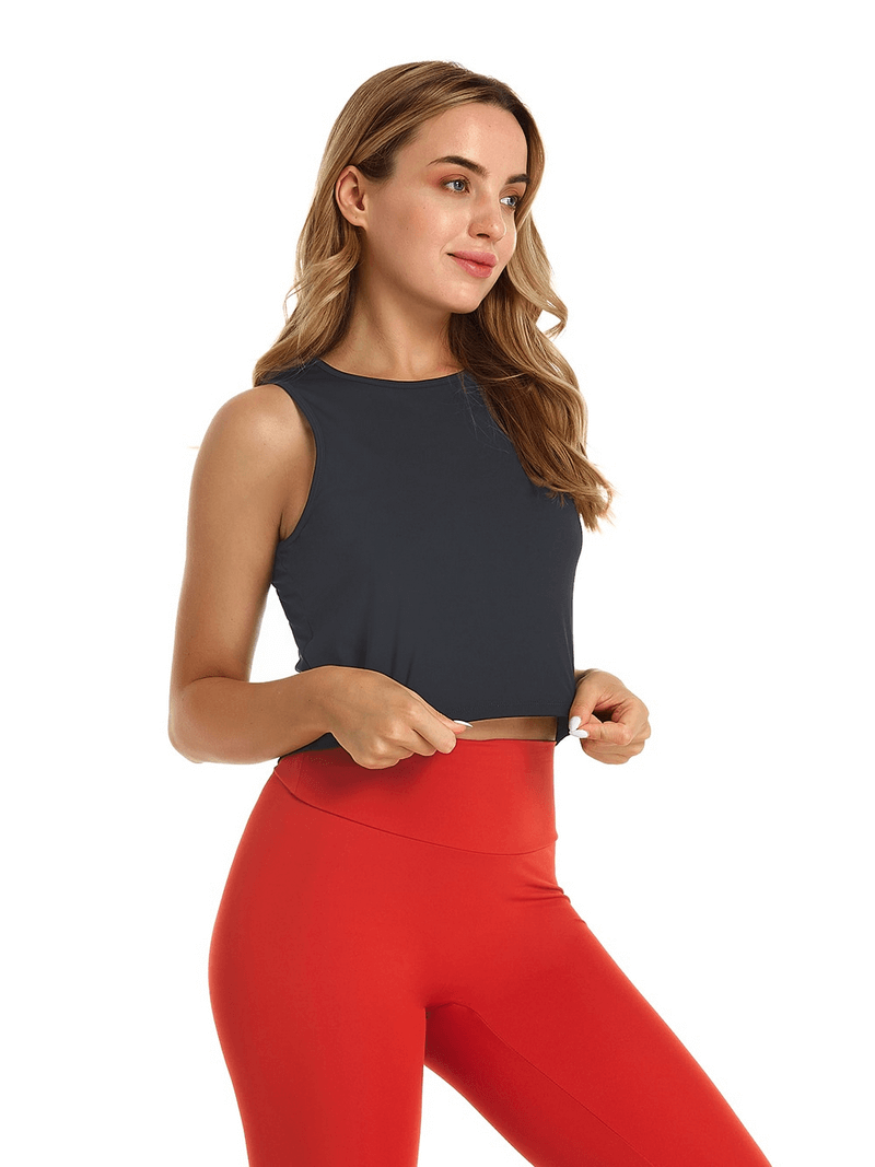 Woman wearing elastic stylish top with cutout back for yoga