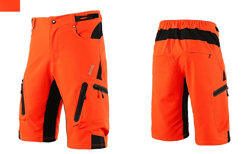 Bright orange cycling shorts with elastic waistband and side pockets, featuring reflective accents for safety and comfort.