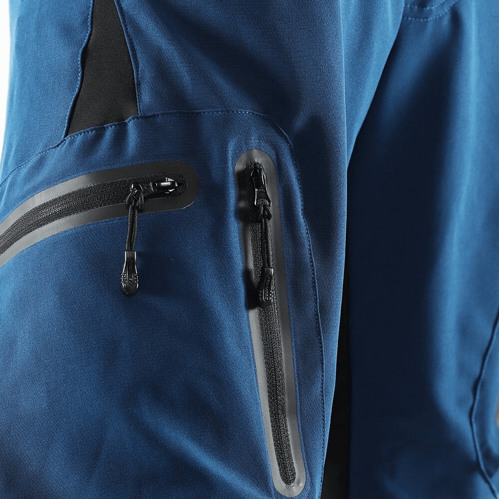 Close-up of blue cycling shorts with elastic waistband and side zipper pocket, showcasing durable fabric.