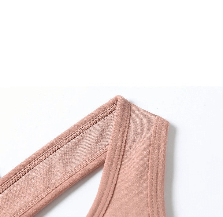 Close-up of pink elastic strap from women's sports top bra.