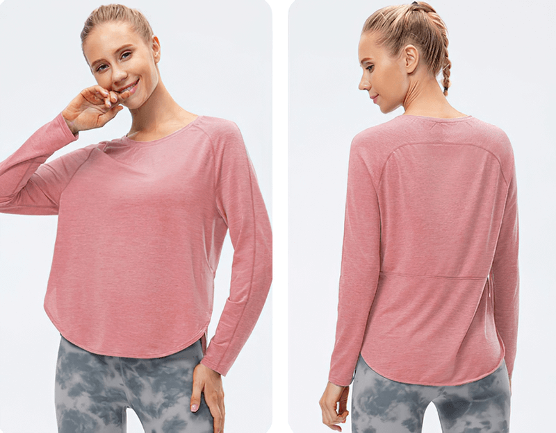 Women's pink elasticity loose top with draped hem and long sleeves, perfect for yoga or workouts, featuring a split design.
