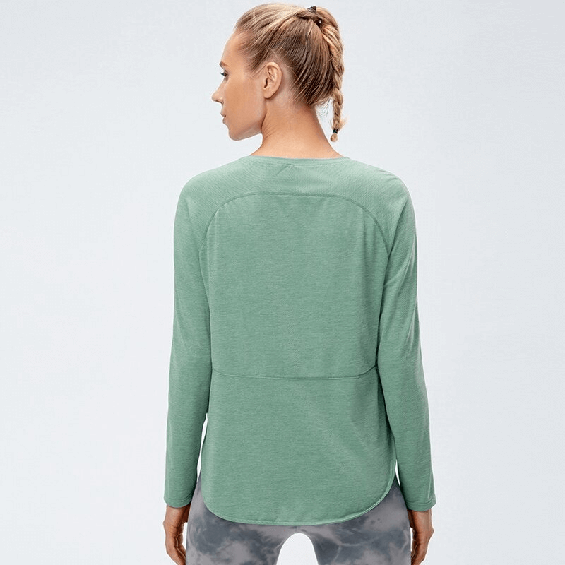 Back view of a woman wearing a green Elasticity Loose Top with Draped Hem, perfect for yoga, featuring long sleeves and premium comfort.