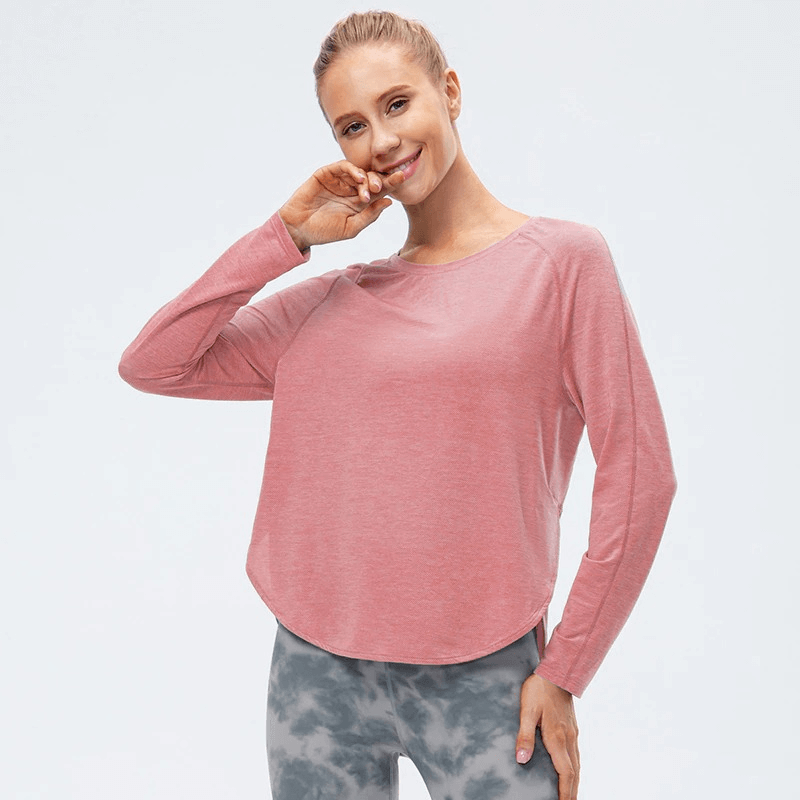 Women's pink Elasticity Loose Top with draped hem, long sleeves, and split design for yoga and sports.