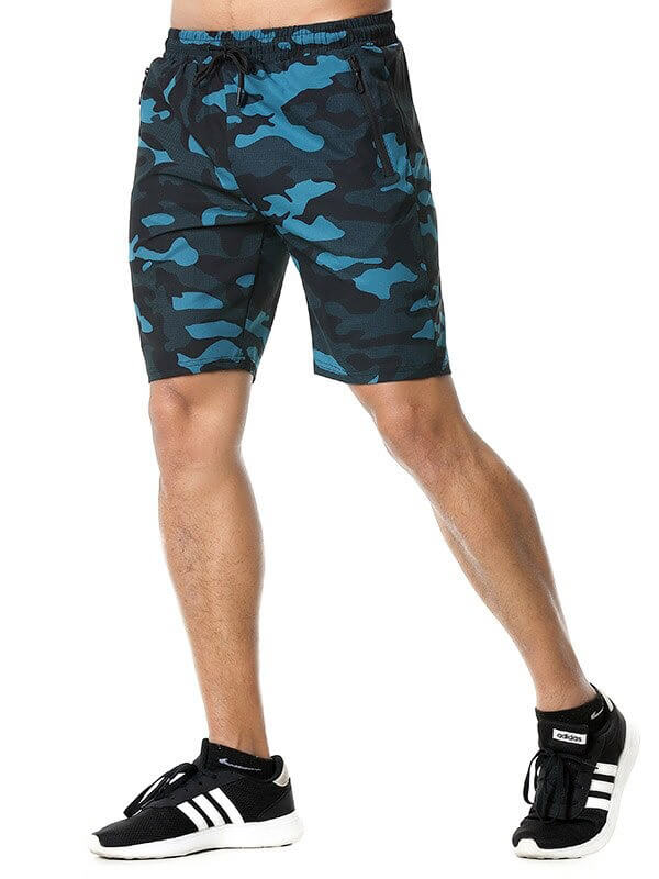 Man wearing blue camo drawstring shorts with pockets, perfect for activities, made of breathable polyester and spandex for comfort.