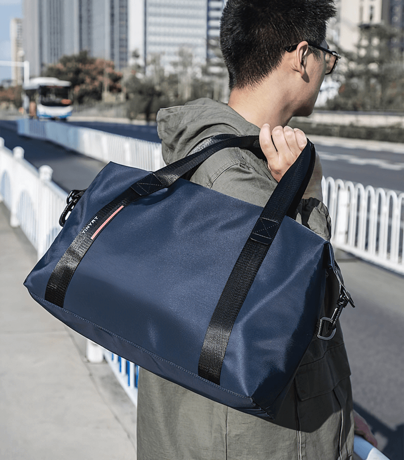 Unisex fashion casual sports shoulder bag in navy blue, ideal for travel with lightweight, waterproof design and 20-35L capacity.