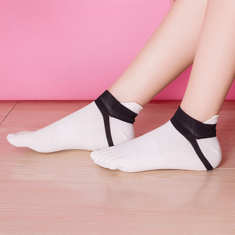Women's colorful cotton five-finger socks for comfort and support, antibacterial and breathable in a stylish design. Model wearing white socks.