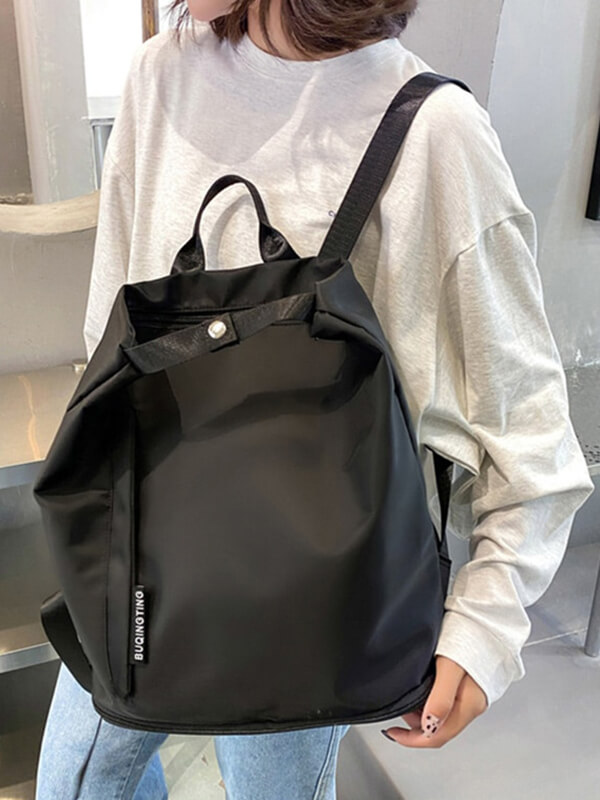 Fashionable black waterproof backpack with drawstring closure, ideal for style-conscious travelers. SF0816 luxurious, dual-layer design.