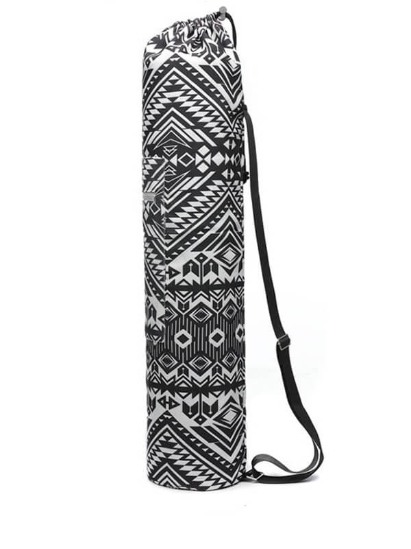 Stylish black and white yoga mat bag with geometric print and adjustable strap, perfect for fitness enthusiasts. Capacity less than 20L.