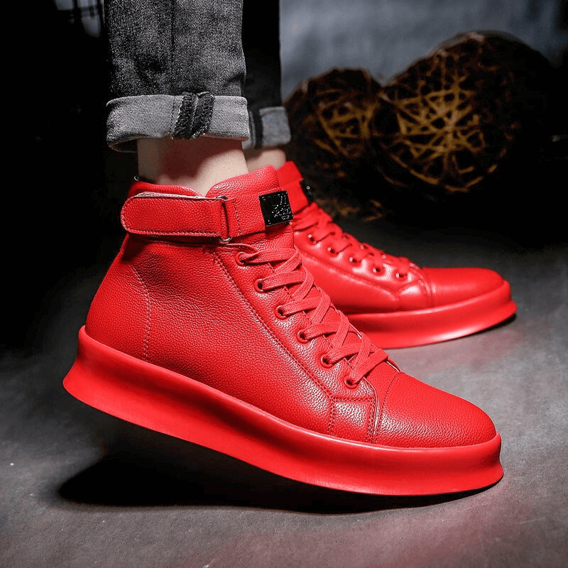 Stylish red high-top sneakers with laces and Velcro, featuring leather material and a durable rubber sole for men's fashion.