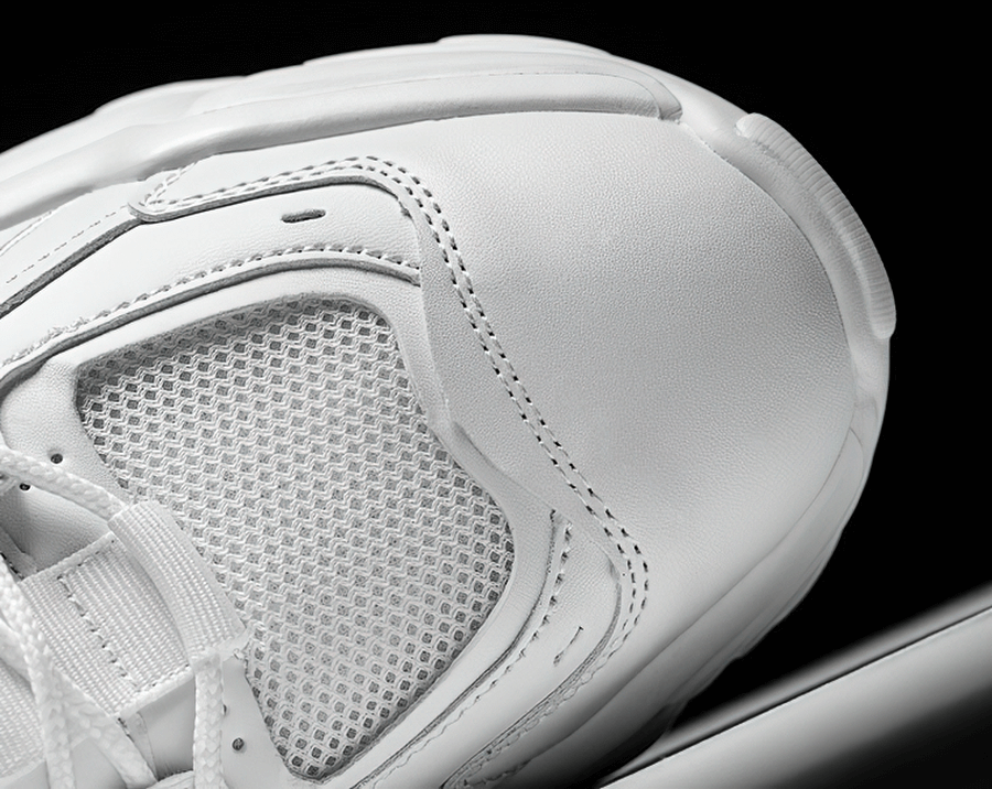 Close-up of fashionable white lace-up platform sneaker with breathable mesh and EVA outsole, SF0651.