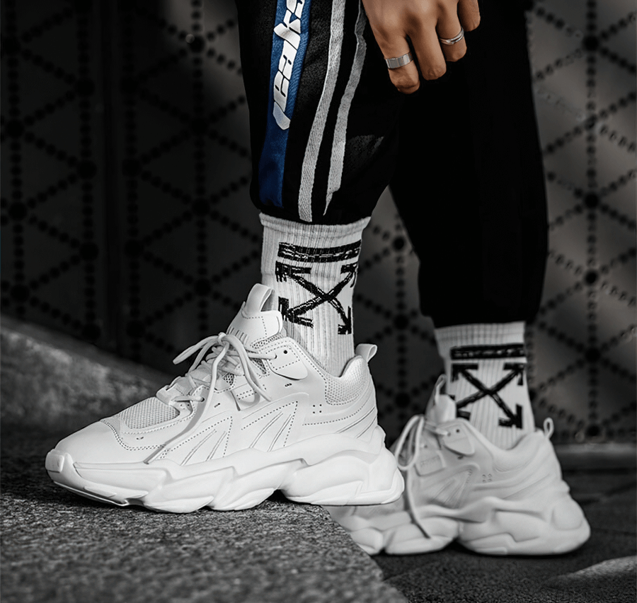 Stylish white lace-up platform sneakers for men with breathable mesh, perfect for sports and casual wear.