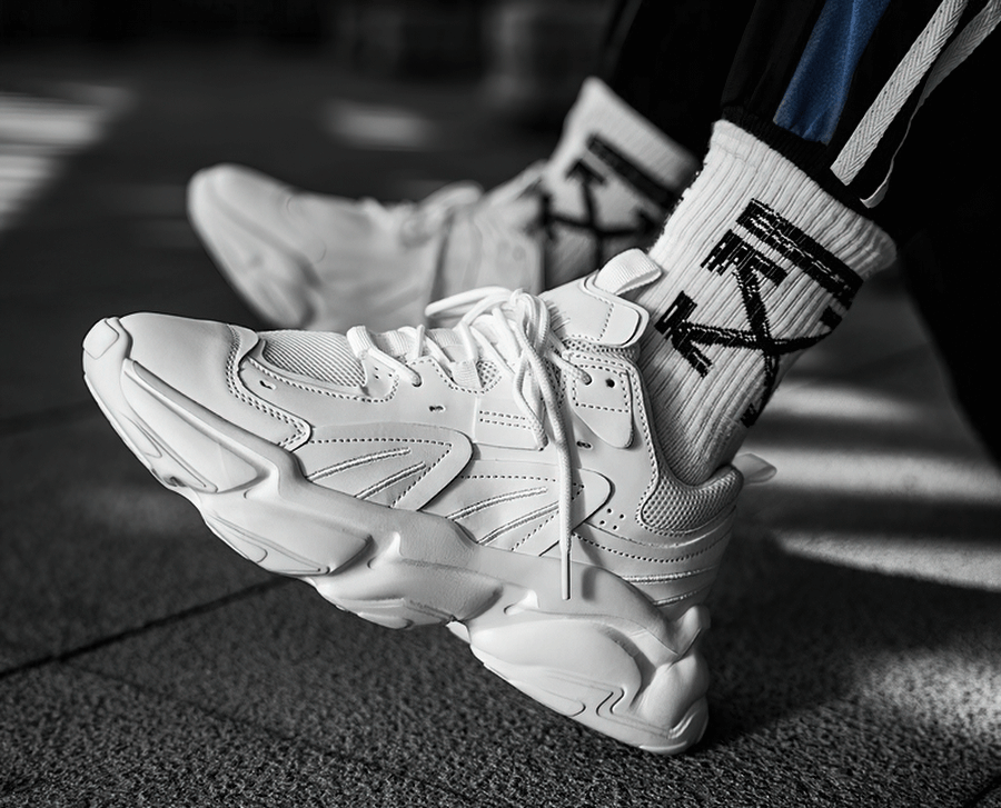 Fashion lace-up platform male sneakers in white with mesh design, offering breathability and style for sports enthusiasts.