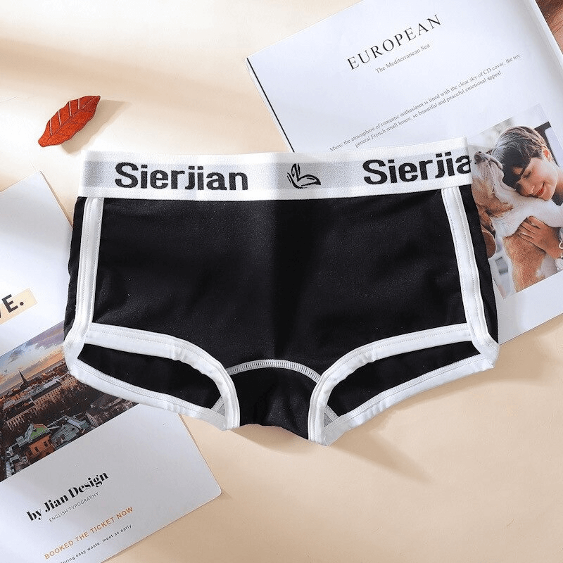 Black cotton sports brief with white trim and letter print waistband, perfect for comfort and style.