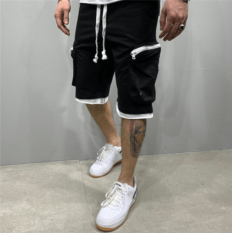 Fashion men's cotton running shorts with zipper pockets, elastic waistband, and sneakers. Perfect for comfort and style in exercise.