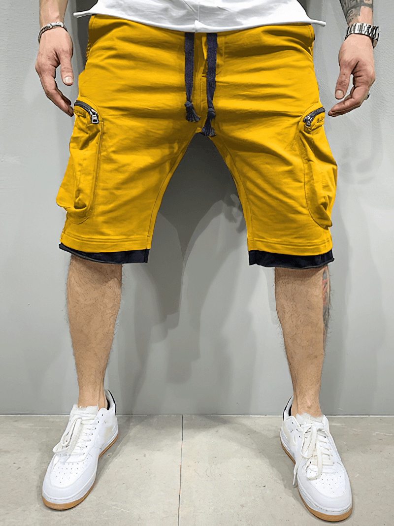 Vibrant yellow men's cotton running shorts with zipper pockets, featuring an elastic waistband, perfect for stylish workouts.