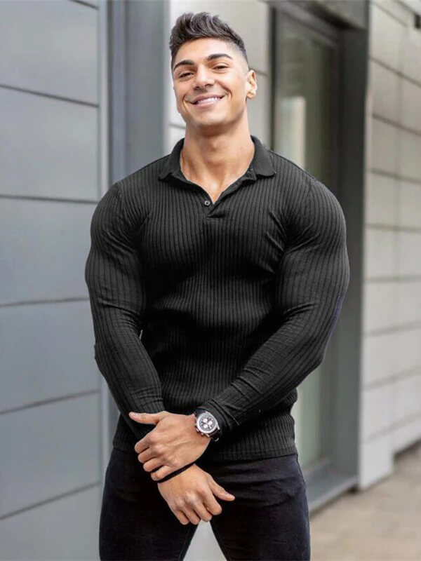 Fashionable men's slim fit black knitted top with long sleeves, perfect for casual or active wear. Model showcasing stylish outfit.