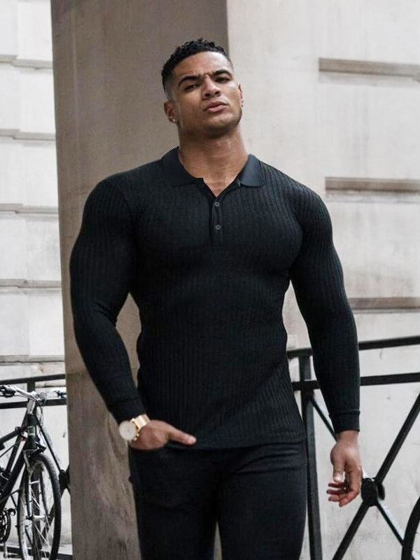 Man wearing a black slim fit long sleeves knitted top, outdoors, showcasing athletic and stylish casual fashion.