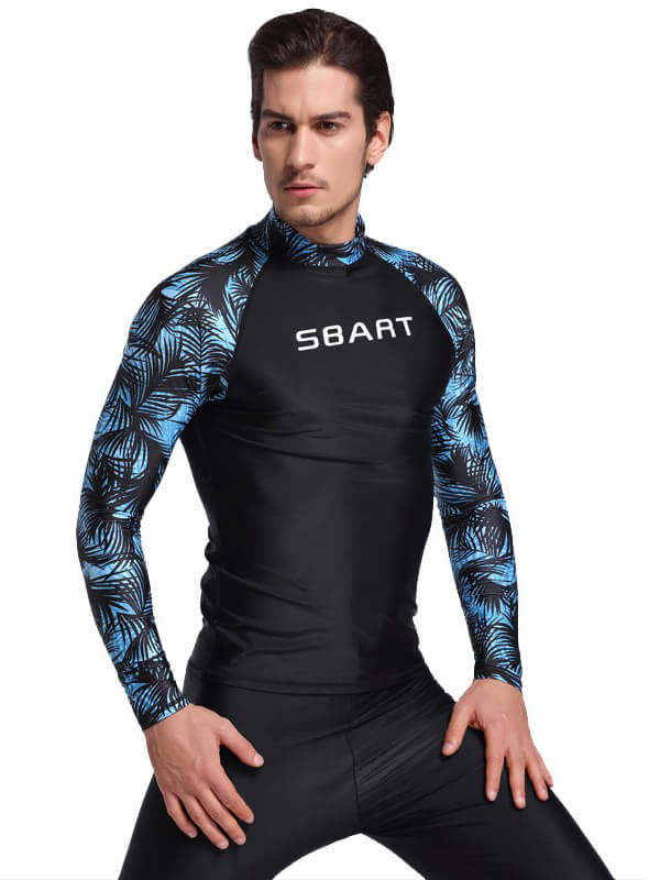 Model wearing men's stretch long sleeve rashguard with blue palm print and "SBART" logo.