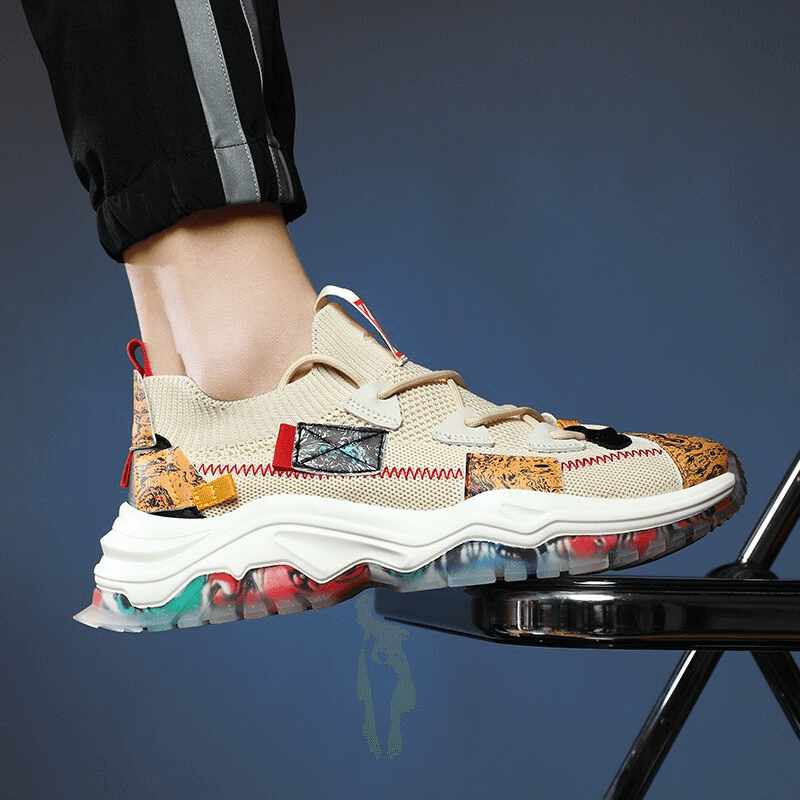 Stylish mesh breathable men's sneaker with thick soles on display, showcasing modern design and comfort in beige and colorful accents.
