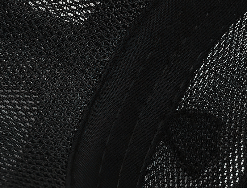 Close-up of black mesh embroidery design on a unisex baseball cap, showcasing the intricate stitching pattern and breathable fabric.