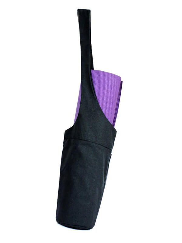 Stylish one-shoulder yoga bag with purple mat, black canvas design, and additional zippered pocket for added convenience.