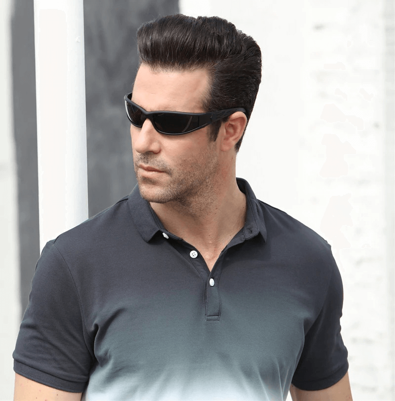 Man wearing Fashion Polarized Sunglasses SF0278 with anti-glare lenses, styled in a dark polo shirt, gazing confidently outdoors.