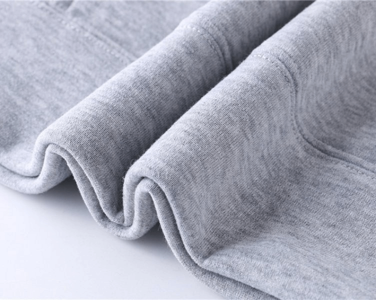 Close-up of soft grey fabric of men's sweatshirt, highlighting texture and quality. Ideal for casual wear. SF0373 fashion solid color hoodie.