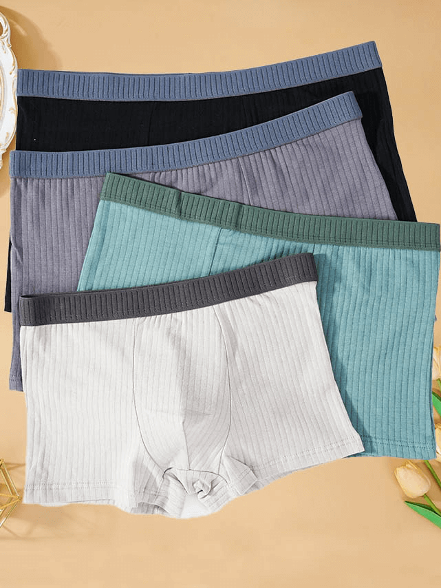 Fashion Stripe Solid Color Cotton Boxers for Men in assorted colors, showcasing superior comfort and modern style.
