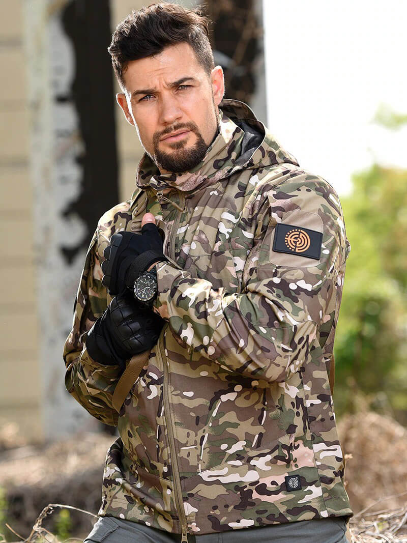 Model wearing Fashion Tactical Jacket with Hood, Men's Hunting Windbreaker SF0590; camouflage design, perfect for outdoor adventures.