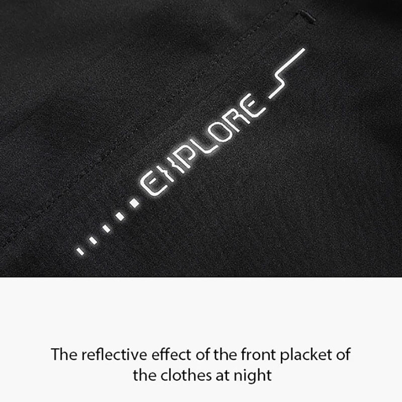 Reflective Explore logo on black windbreaker, showcasing night visibility feature for outdoor sports jacket SF0781.