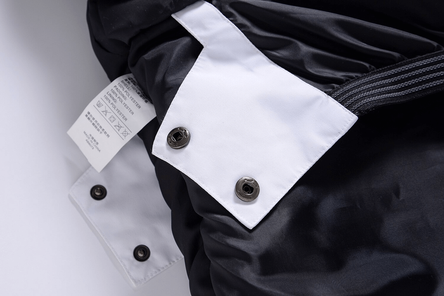 Close-up of the Fashion Unisex Ski Jacket with hood showing buttons and fabric, highlighting durable outdoor materials. Model SF0875.