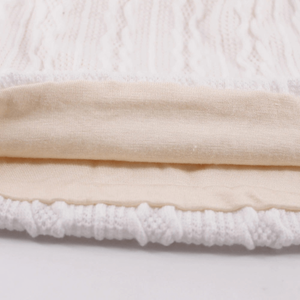 Close-up of a cozy knit fabric detail for a unisex beanie hat, showcasing soft cotton and polyester blend.