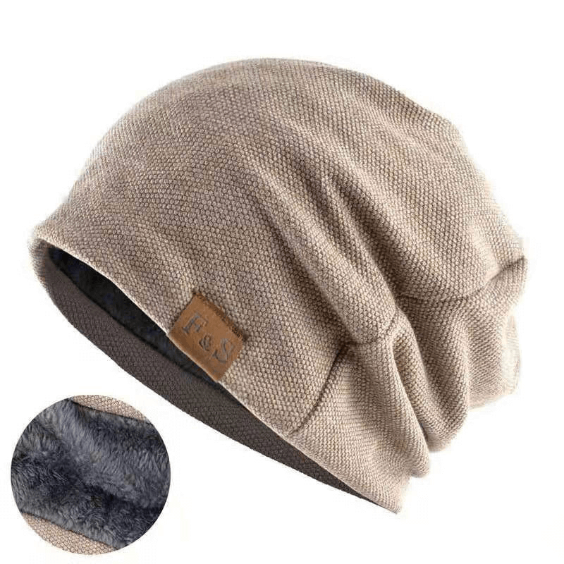 Cozy beige knitting beanie with soft fur lining, perfect for winter outdoor sports like skiing and snowboarding.
