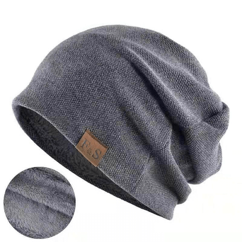 Gray unisex warm knitting beanie with fur lining for outdoor sports, showcasing stitching details and stylish letter pattern.
