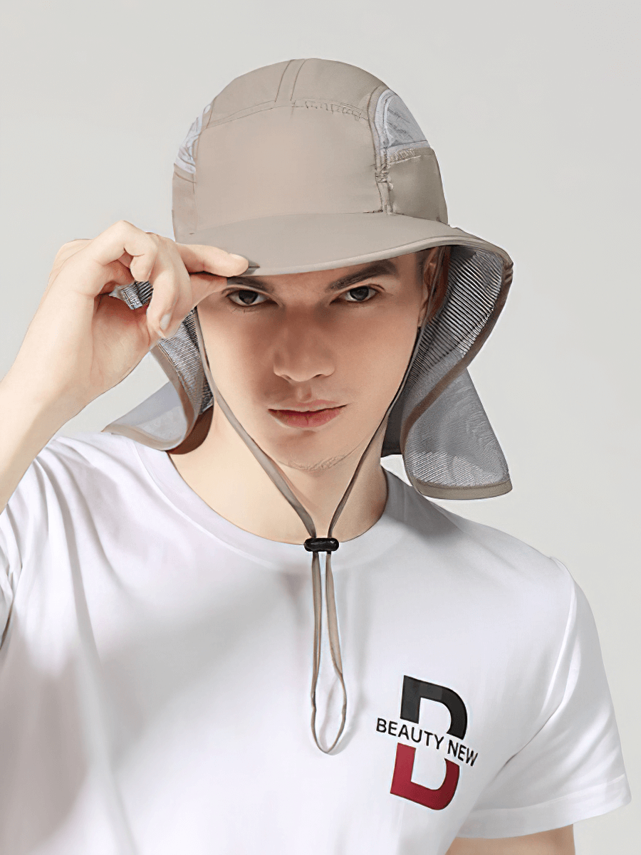 Man wearing a multi-functional wide-brimmed sun hat with neck protection, offering UPF 50+, in beige color, perfect for sun safety.